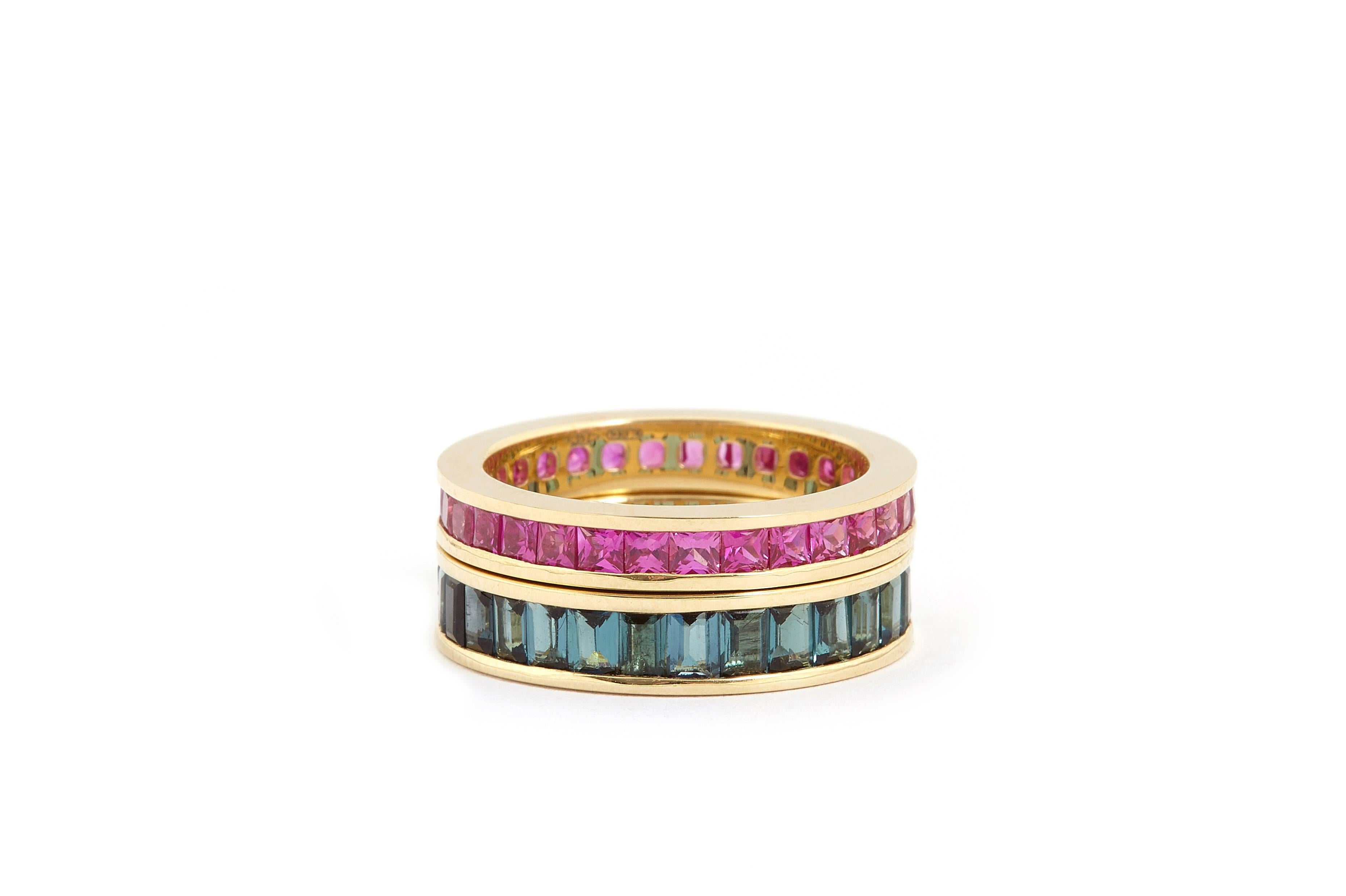 Eternity ring invisibly set pink princess cut rubies in 18k yellow gold. Crafted in Italy by master craftsmen. 

The Eternity design symbolises eternal love. Fouché bespoke band rings are created to your band size; available in US band size 4 to 7.