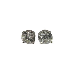 European Cut Diamond Stud Earrings Set In Platinum Four Prong Settings