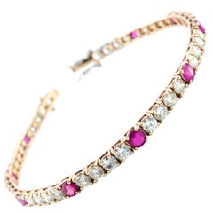 Pulsera de tenis de oro rosa con diamantes y rubíes