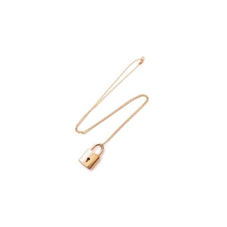 Marisa Perry lock pendant necklace in 18k rose gold with 18k rose gold chain. Designed by Douglas Elliott for Marisa Perry Atelier. A luxury jewelry boutique in New York's West Village. 