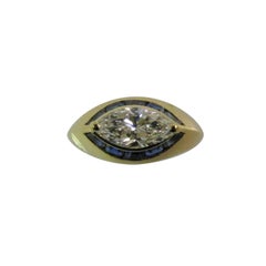 18 Karat Yellow Gold Ring with Blue Sapphires and 1.03 Carat Marquise Diamond