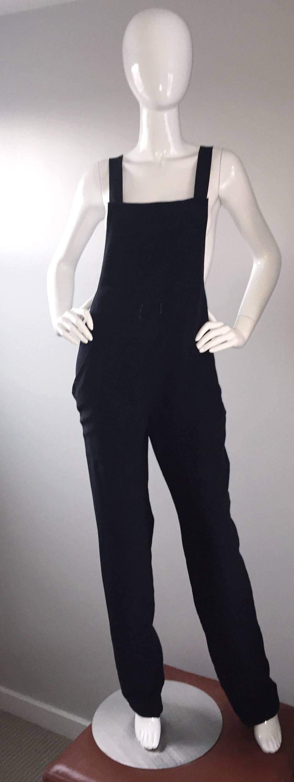 Super rare vintage 1990s brand new with tags FW 1997 Gucci, by Tom Ford black silk jumpsuit! So much style to this amazing piece, that has never been worn! Chic style, with a slouchy, yet fitted fit, and racerback. Three buttons on interior shoulder