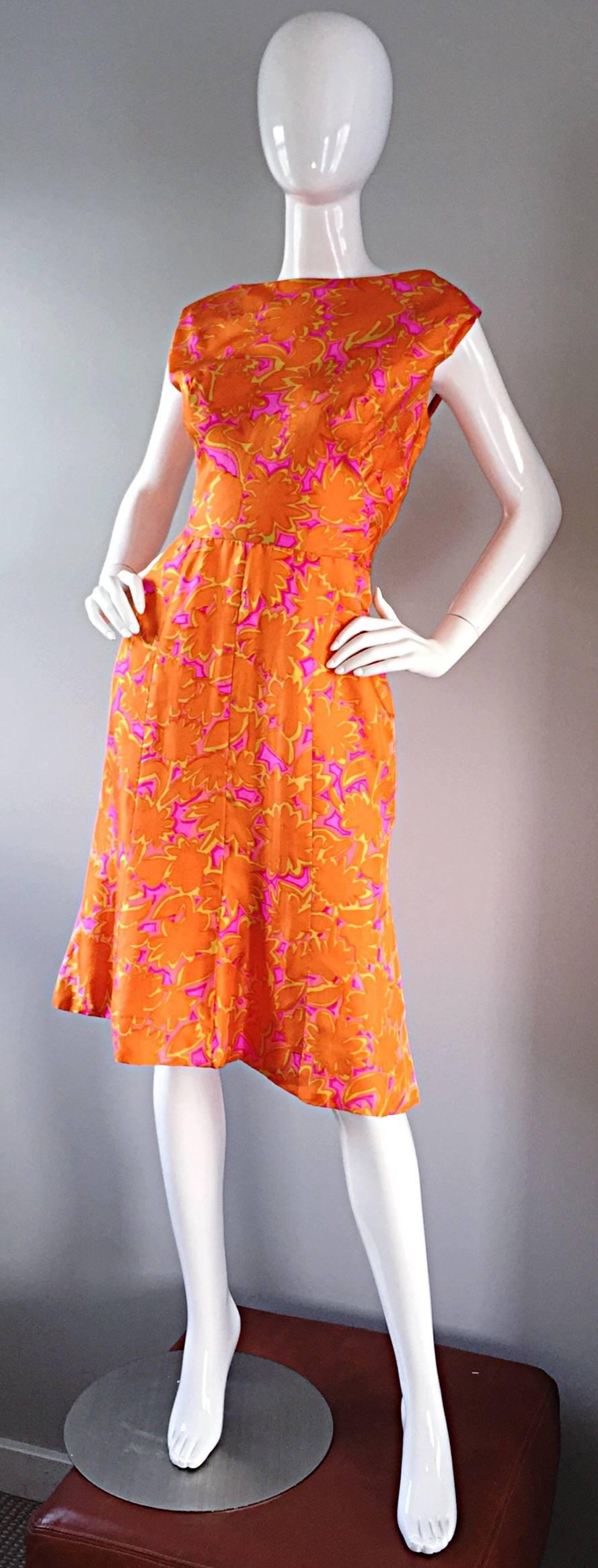 Beautiful 1960s silk dress, in bright orange, hot pink, and yellow! Chic floral psychedelic print, with an amazing, flattering silhouette! High neck, with an amazing draped back. Metal zipper up the side. Fully lined in silk. Extremely well made.