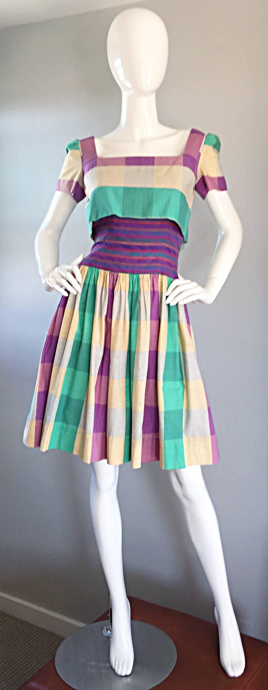 Important Bob Mackie late 70s/early 80s dress! From the era of Mackie's 'hype,' this dress mirrors his femininity, and attention to detail. Cotton layers of plaid, with an attached bolero type top, rainbow waistband, and full skirt. In great