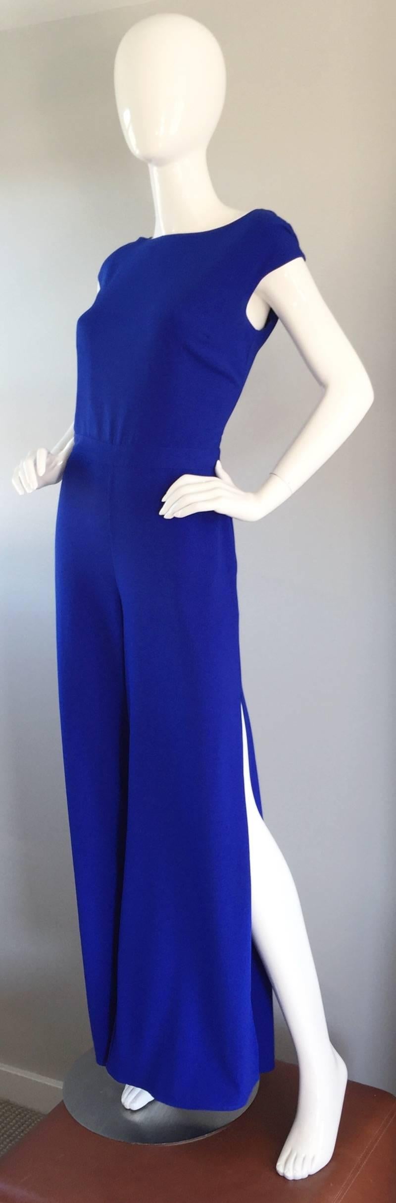 So Chic!!! MAX MARA silk jumpsuit, in a beautiful cobalt blue color! Stylish wide legs, with slits up the outside seam on each leg. Sleek and sophisticated fit, with just the right amount of sexiness and femininity. Peek-a-boo back, with clear