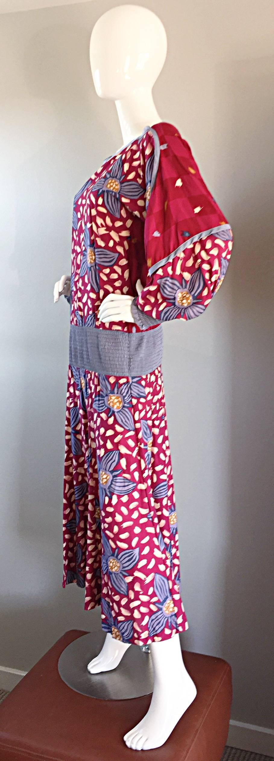 Amazing vintage JEANNE MARC drop waist boho dress! Raspberry pink background, with blue flowers, and paintbrush-like strokes throughout. Denim colored elastic waistband, with matching sleeve cuffs. Dolman sleeve bodice, so will fit many sizes. Has a