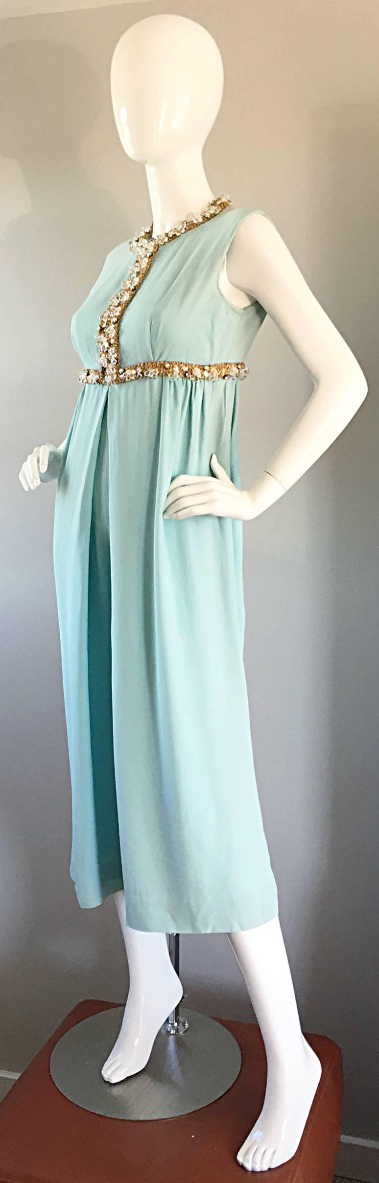 Amazing vintage 60s sky blue silk culottes jumpsuit! Adorned with rhinestones, crystals, sequins, and handsewn gold tone trim. Demi Couture quality, with hand finished details. No labels remain, but mirrors construction of a high end designer. Wide