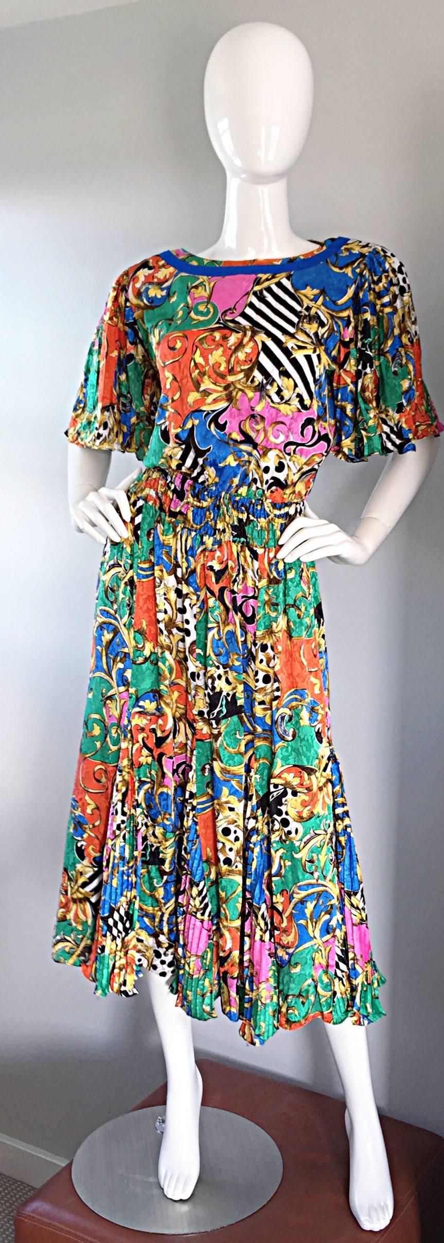 Amazing vintage Diane Freis / Diane Fres psychedelic colorful dress! Features a variety of prints throughout, including stripes and baroques. Pleated 'flutter' sleeves, with matching pleated skirt, that looks sensational on! As with most Diane Freis