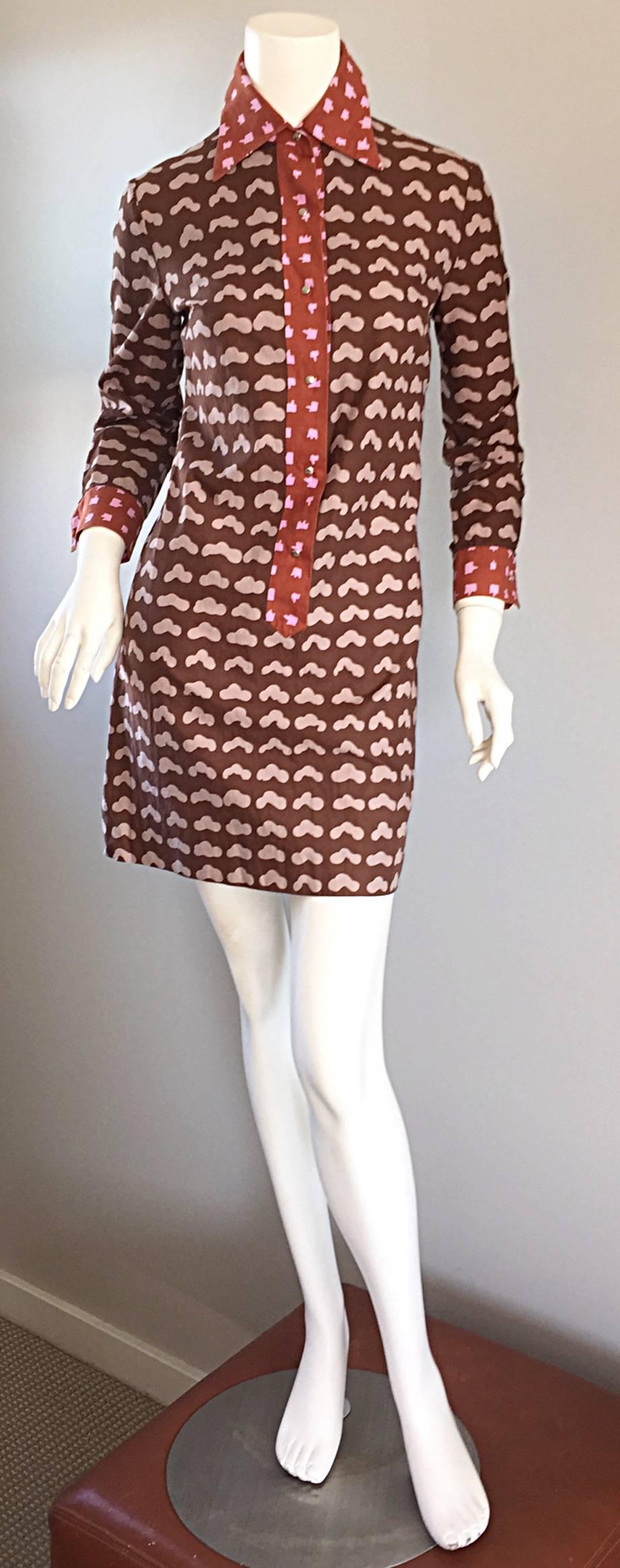 

The perfect cotton shirt dress, from Marimekko of Finland! Label is dated from 1969. Early Marimekko pieces like this are becoming harder and harder to find, and are considered highly collectible. Burgundy/brown background, with light pink