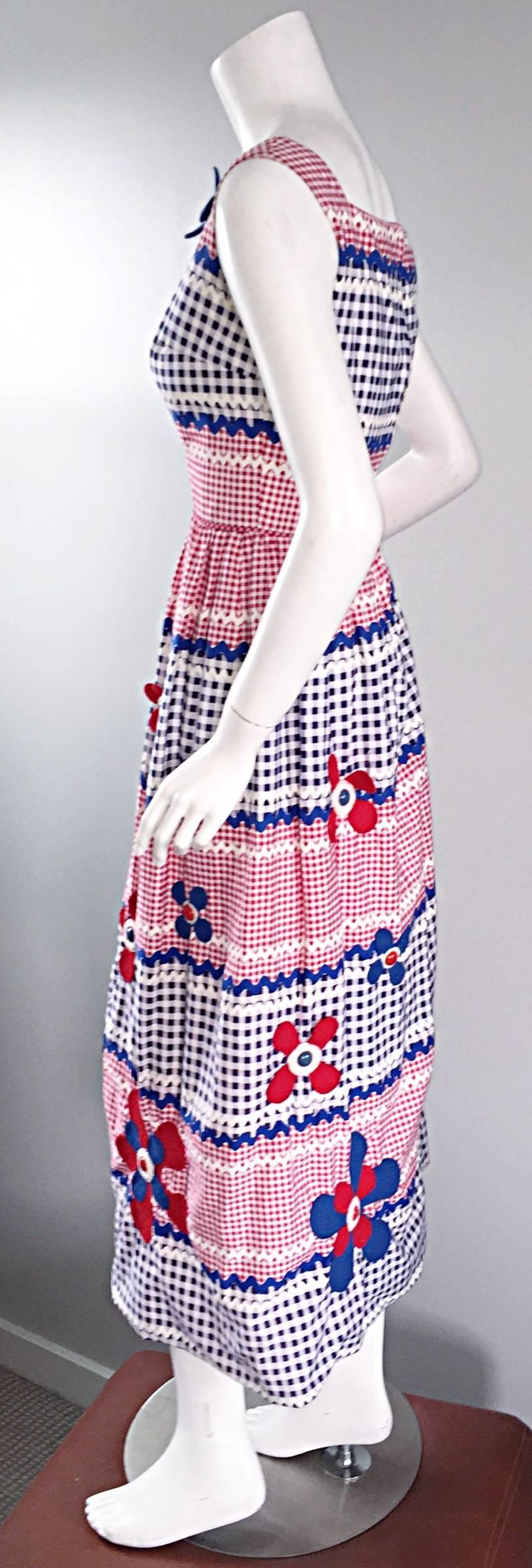 Amazing, IMPORTANT, and extremely rare 1960s Malcolm Starr, by Gino Charles, Caspian Sea Collection cotton maxi dress! Red, white, and blue gingham, in a variety of sizes, with rick rack print edges. The most amazing part---Wool felt flower