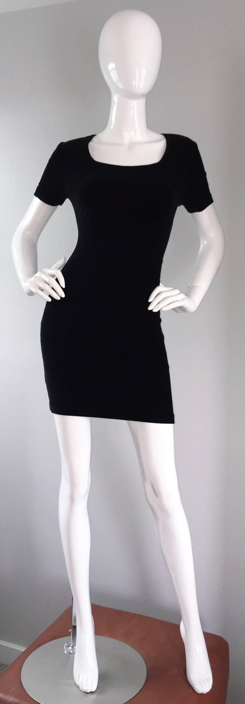 Sexy early 1990s Michael Kors, for Bergdorf Goodman, BodyCon black velvet mini dress! I cannot even begin to describe how flattering this little black dress is! Features short sleeves, with a scoop-like neckline. Stretches to fit. Great alone, yet