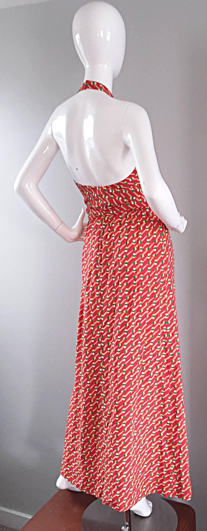 Incredible, and rare vintage Geoffrey Beene 'pill print' burnt orange maxi dress! Amazing jersey material, with a chic wrap-style closure. Attached tie sash belt. Incredible amount of detail, with a stunning fit! Hook-and-eye closures at back neck.