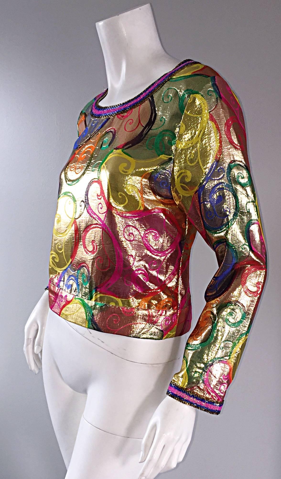 Amazing vintage Diane Freis / Fres silk metallic blouse! Features swirl prints throughout, with beaded collar, and cuffs! Brand new, with original tags. Vibrant metallic colors. Looks great with jeans, a skirt or shorts. Approximately Size