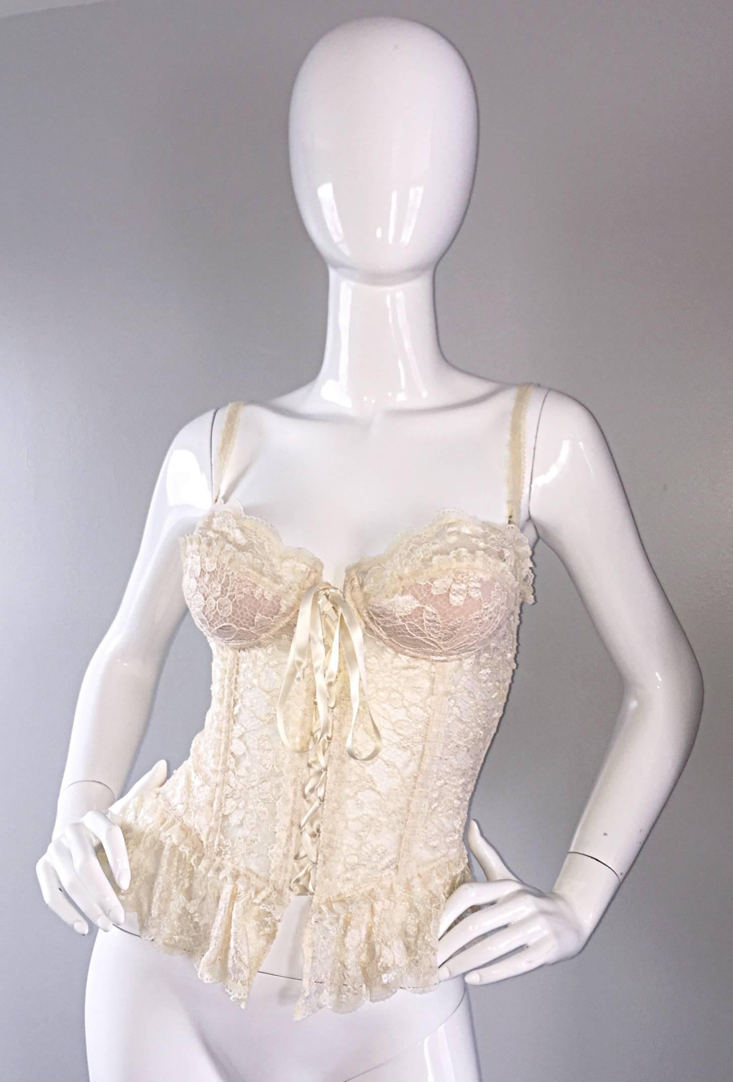 Sexy vintage Moschino Couture ivory lace corset top! Silk ribbon up the bodice, that ties at bust. Adjustable hook-and-eye closures at the back. Brand new, with original tags attached. Looks great with jeans, shorts, under a suit, with dress