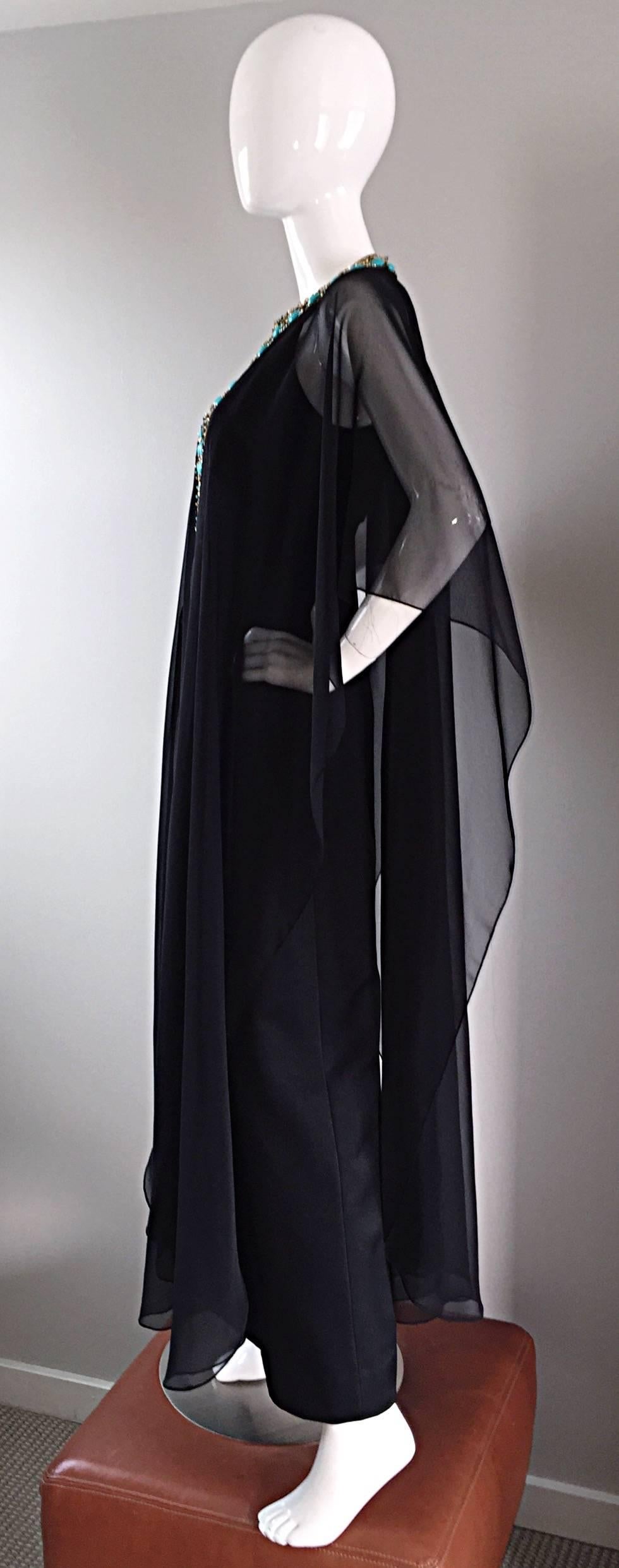 Exceptional 1970s black vintage maxi jersey dress, and matching chiffon caftan / kaftan. Caftan is encrusted with statement worthy large turquoise tribal beads, amongst seed beads, and brass embellishments. Hook-and-eye closures at back neck.