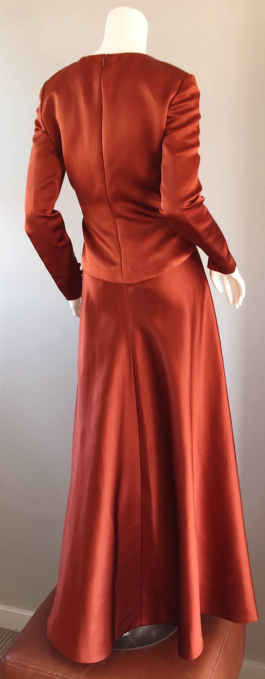 Exceptional vintage BILL BLASS copper colored silk satin evening gown! This dress surely is something else! Tailored long sleeves, with three silk covered buttons at each cuff. Full skirt, that looks amazing on! Slimming seams, with heavy attention
