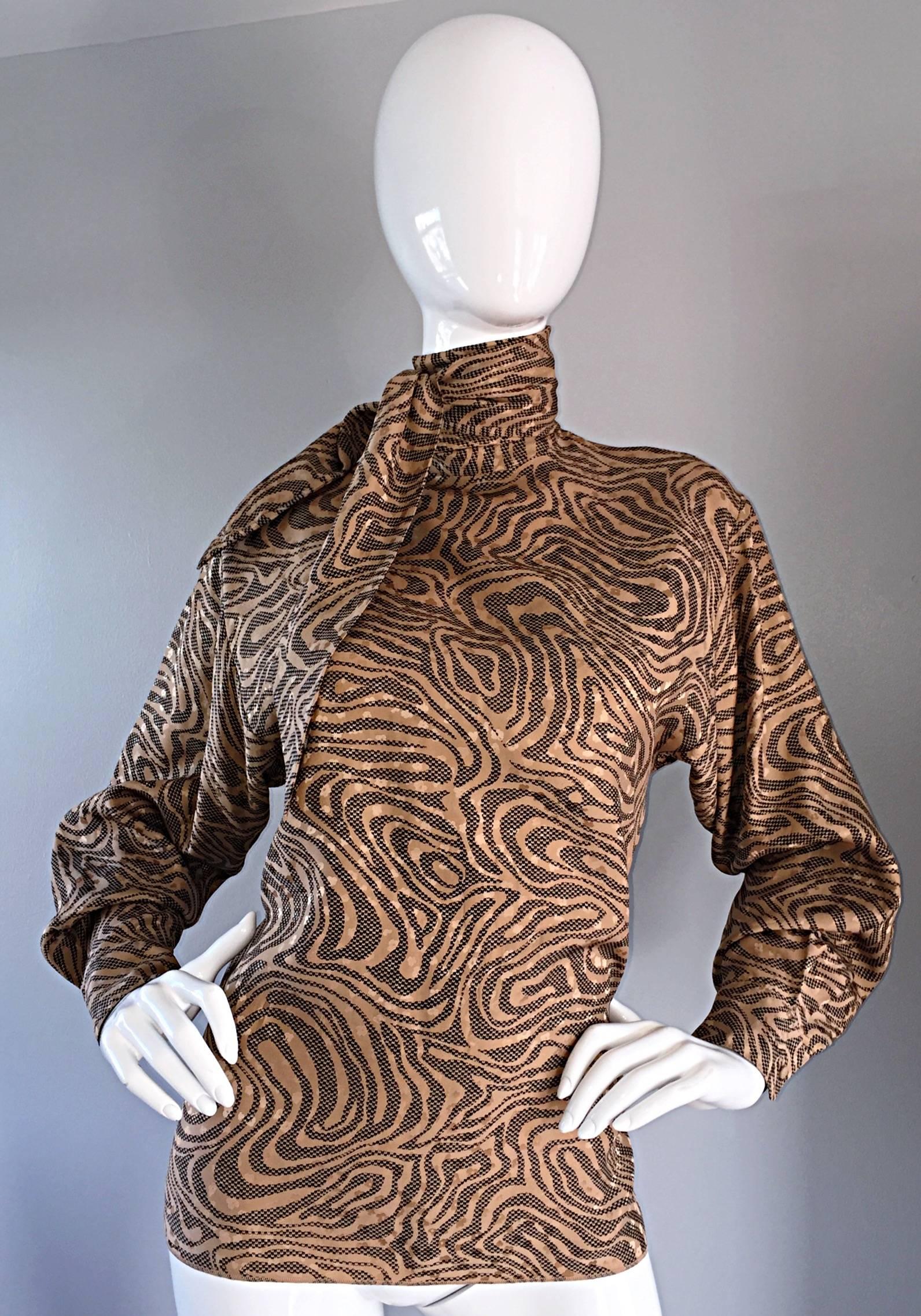 Chic vintage early 1990s / 90s St. John tan, brown, and black silk blouse! Dolman sleeves, with tie at neck, which can be tied in a variety of ways. Amazing animal print, in a swirled design, with flower motifs throughout. Buttons up the back. Can