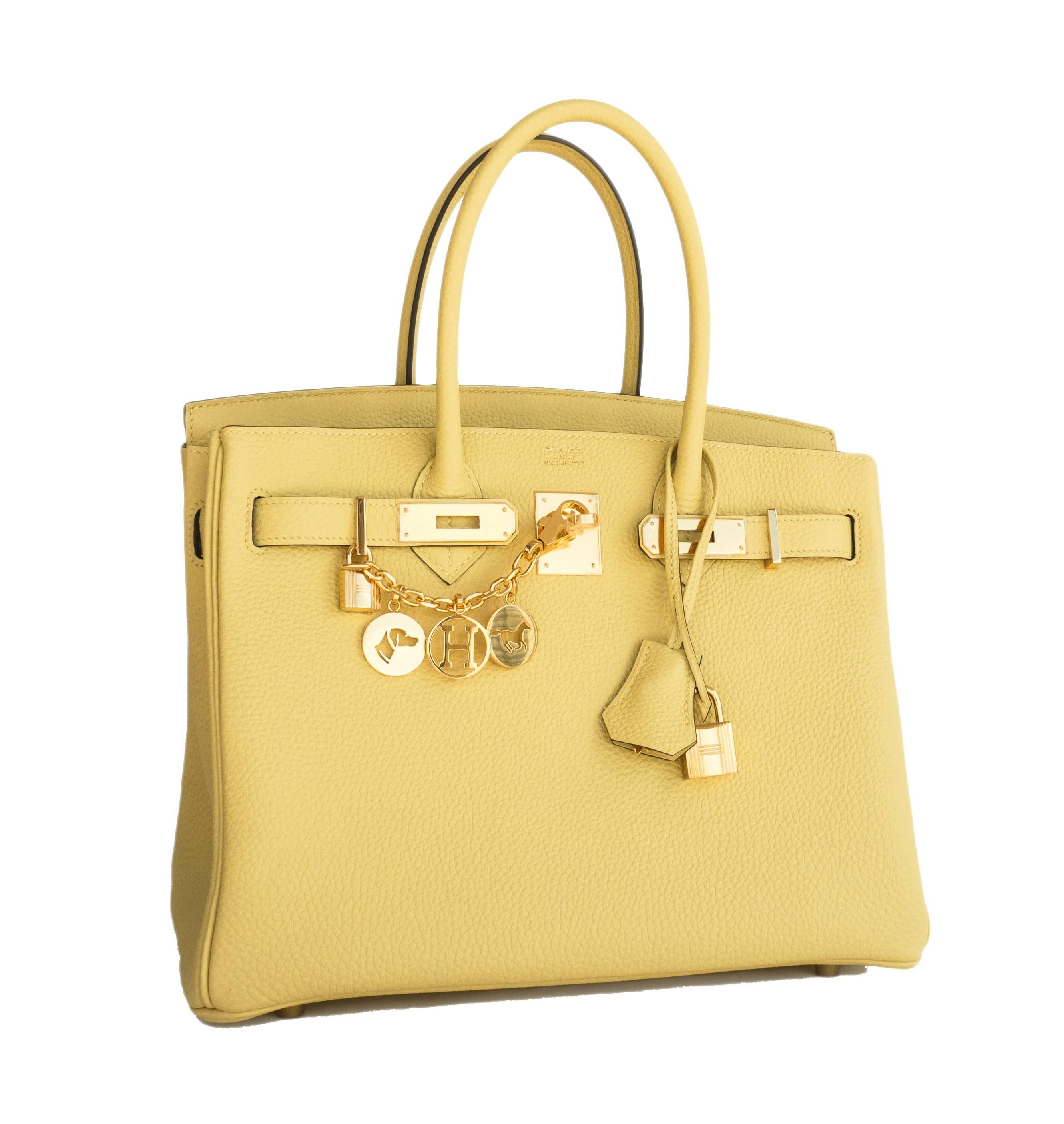 Store fresh. Pristine condition. T stamp. 
Perfect gift! Comes with keys, lock, clochette, a sleeper for the bag, rain protector, Hermes ribbon, and original box.  
Jaune Poussin is Hermes' newest pale yellow.
The color is so chic and