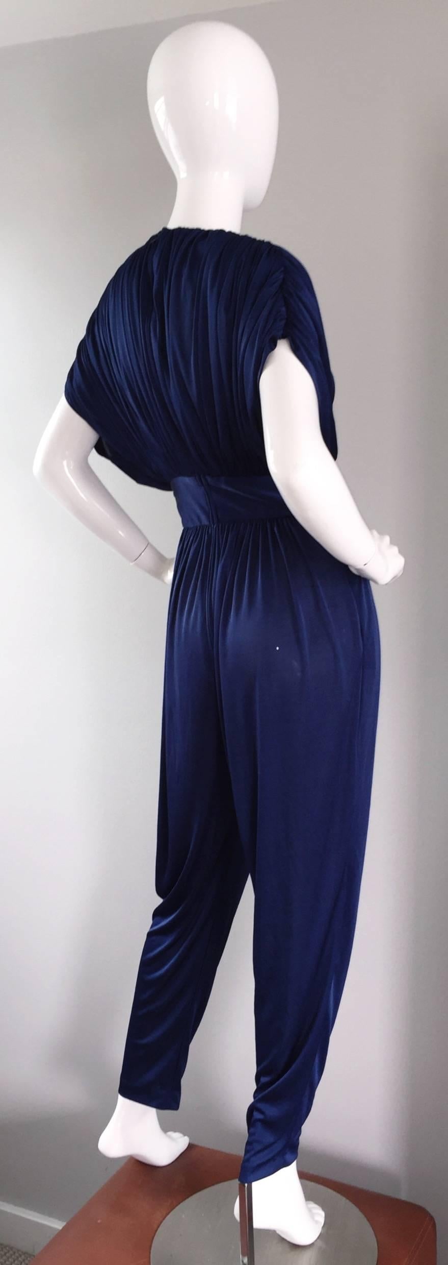 Incredible 1970s royal blue sequined jersey jumpsuit! Sexy, and very on trend. Ruched batwing sleeves (Dolman sleeves), so can fit a variety of bust sizes. Sequined waist. Reminds me of the Halston jumpsuit I once had. Hidden zipper up the back. In