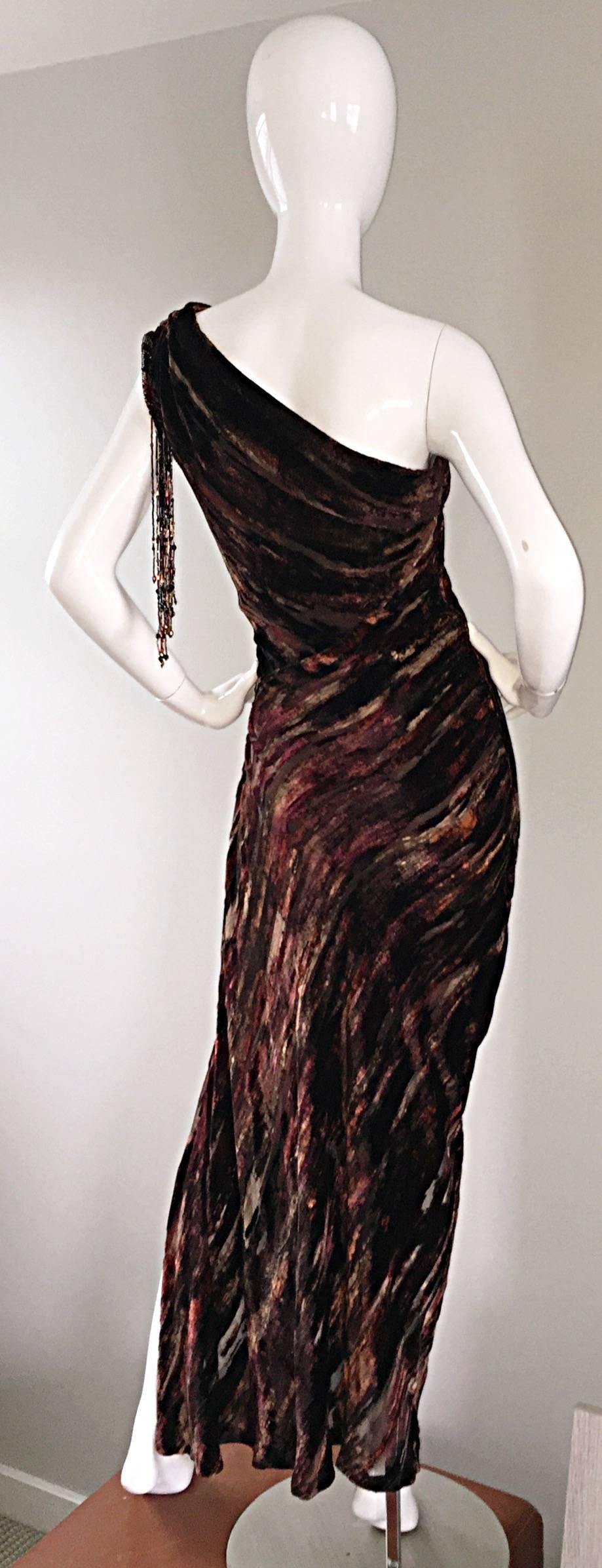Extraordinary vintage Bob Mackie one shoulder burnt-out silk velvet gown! Couture quality, with a heavy amount of attention paid to detail. Autumnal colors of burgundy, wine, and tans. Hand-sen beads at arm hole, and multiples that dangle from the
