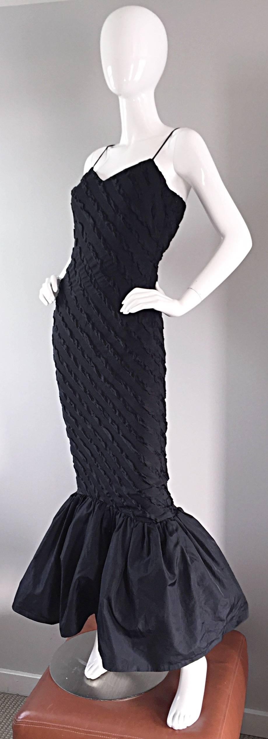 Stunning 1950s Lilli Diamond black silk wiggle mermaid dress! Hugs the body in all the right places, and gives that perfect hourglass silhouette. Black embroidery throughout, with a full taffeta hem. Looks great alone, or belted. Perfect with long