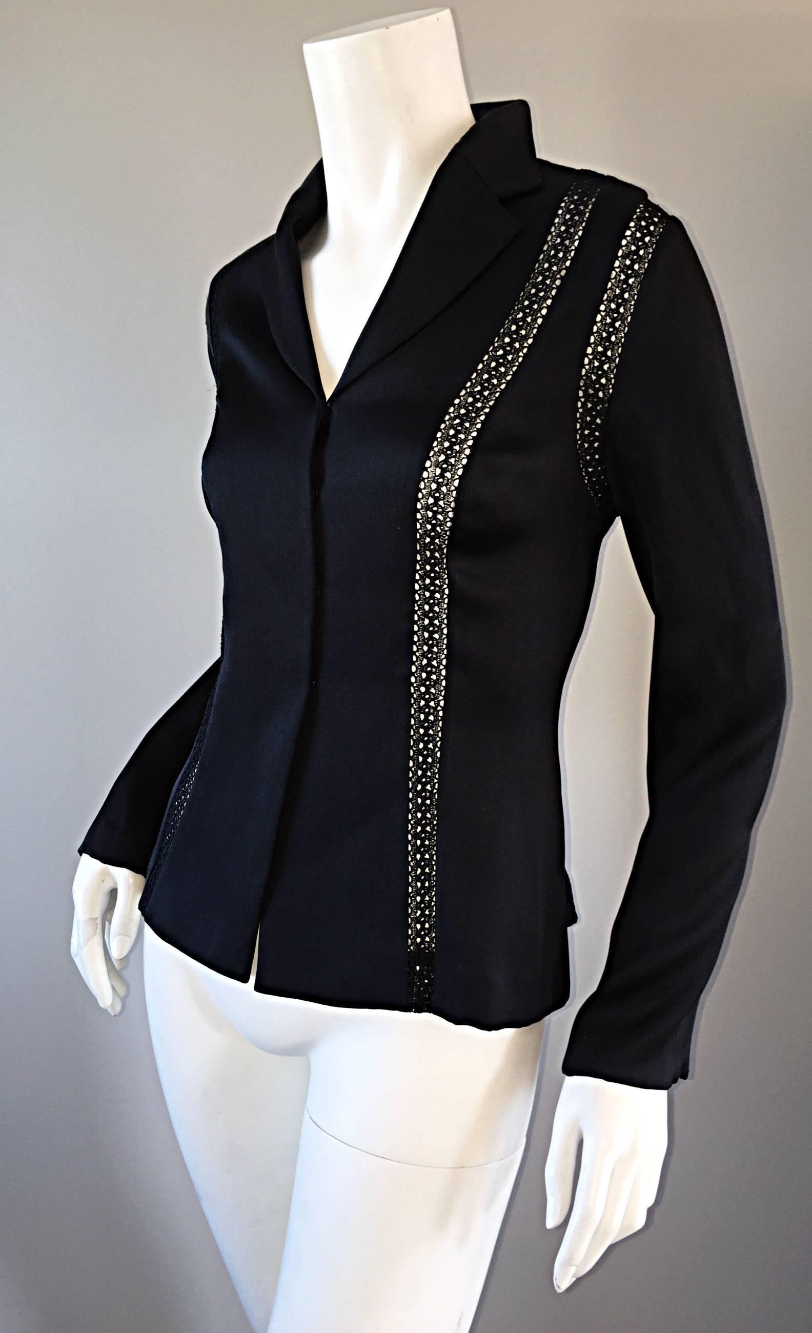 Beautiful vintage Richard Tyler black silk blouse! Features cut-out panels on the front and back. Luxurious soft silk, with hook-and-eye closures down the bodice. Wonderful tailored fit! Can be worn buttoned all the way up, or left partially open.