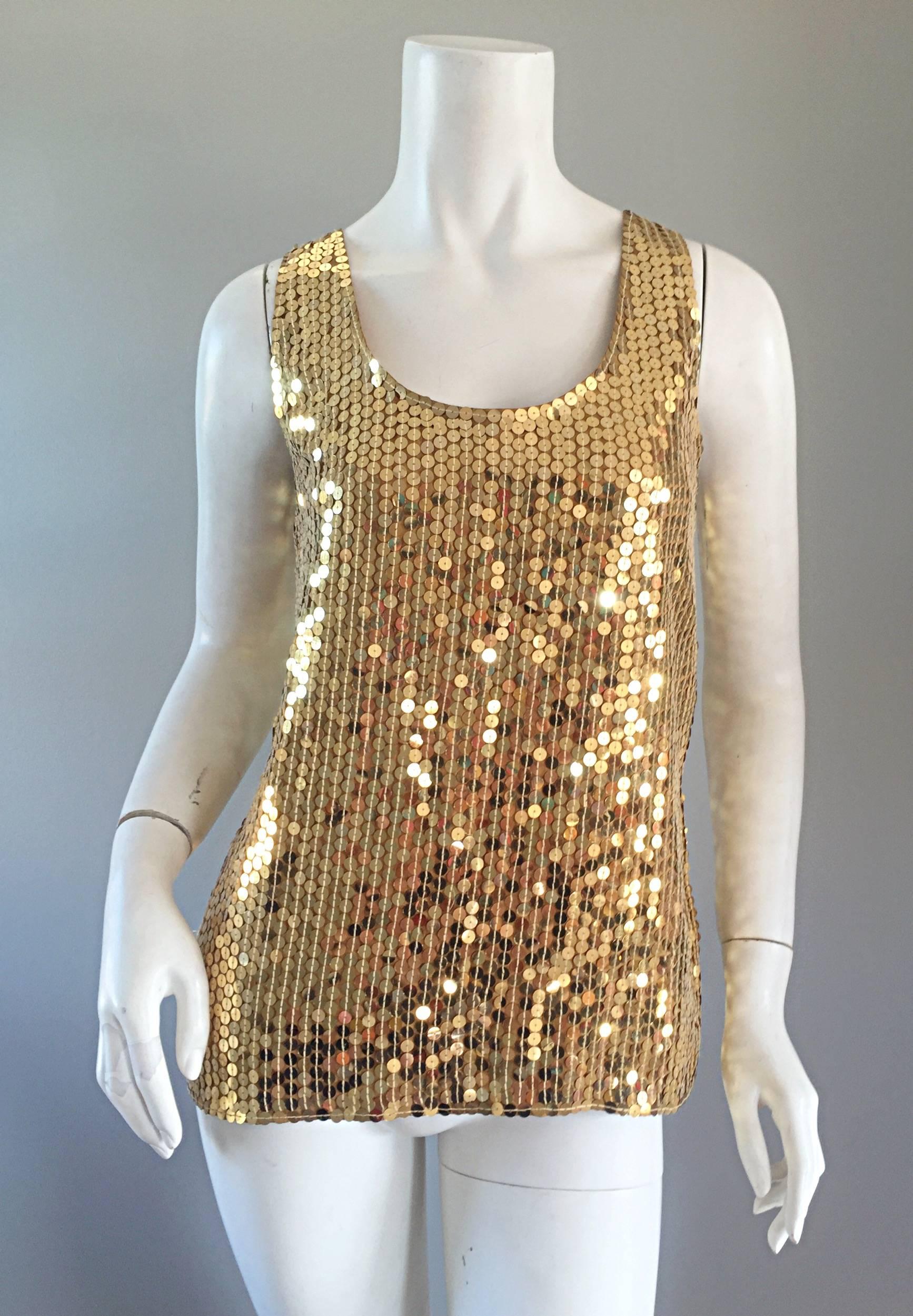 Wonderful vintage Oleg Cassini silk blouse, fully covered with gold sequins! Great shape, that is super versatile. Can easily transition from day to night. Great with jeans, shorts, or a skirt. Perfect alone, or belted. In great condition. Marked