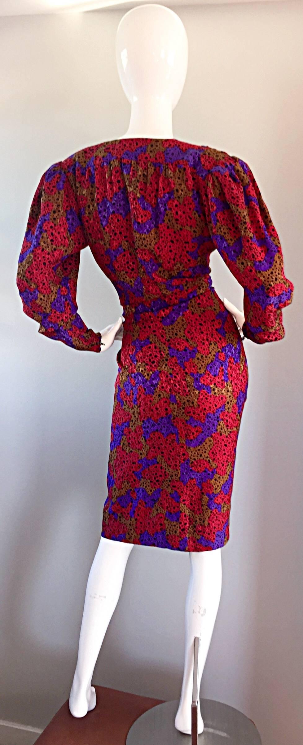 incredible vintage Yves Saint Laurent "Rive Gauche" silk dress. Leopard / cheetah print in signature YSL vivid colors of red, purple, tan and black. Oozes just the right amount of sex appeal with a plunging bust.Wraps around through the