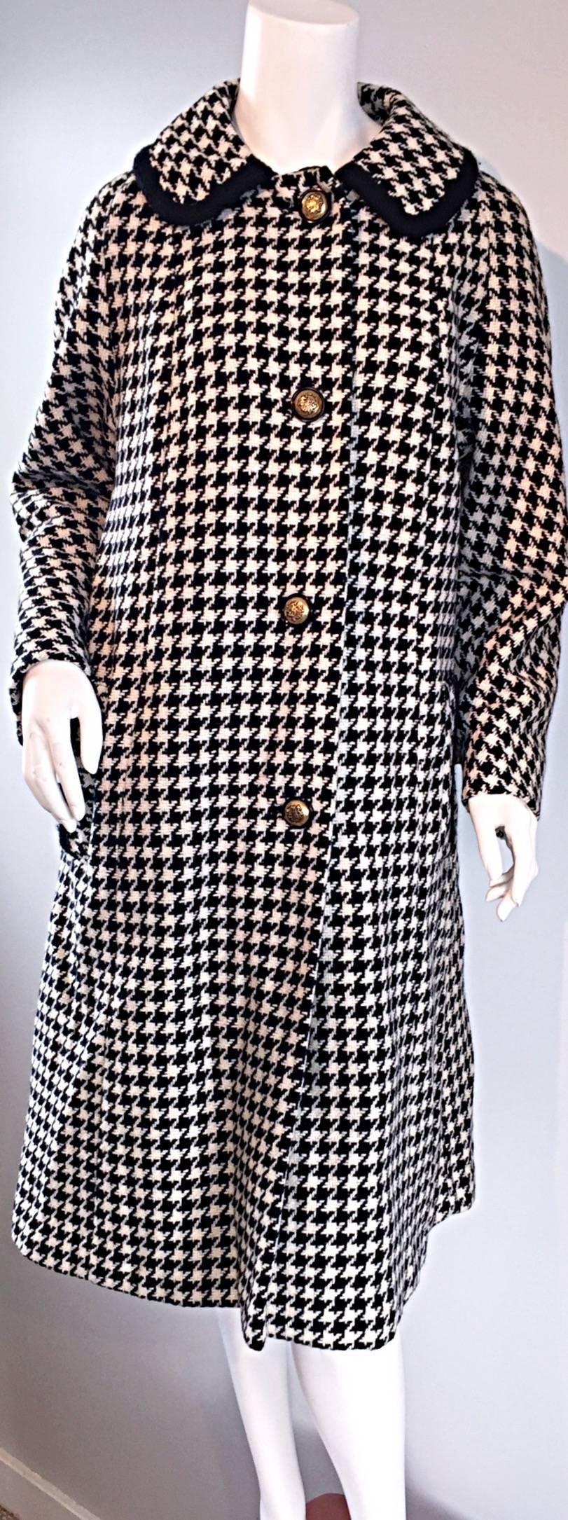 Adorable vintage wool swing jacket! Features all over black and white gingham print, with black embroidered trim at each sleeve cuff, each waist pocket, and on the collar. Jackie-O style, with a classic feminine collar, and engraved brass buttons up