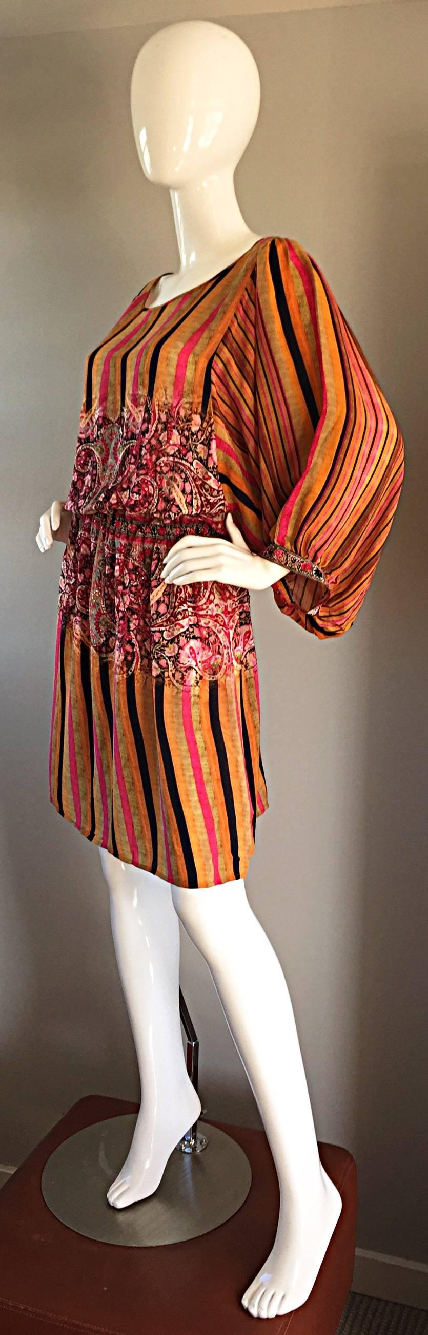 Incredible Matthew Williamson beaded tunic! Ethnic inspired, with a variety of vertical stripes throughout. Paisley and floral print at midsection, with hand-sewn beading throughout. Looks amazing on! Elastic waistband, that stretches to fit. Large