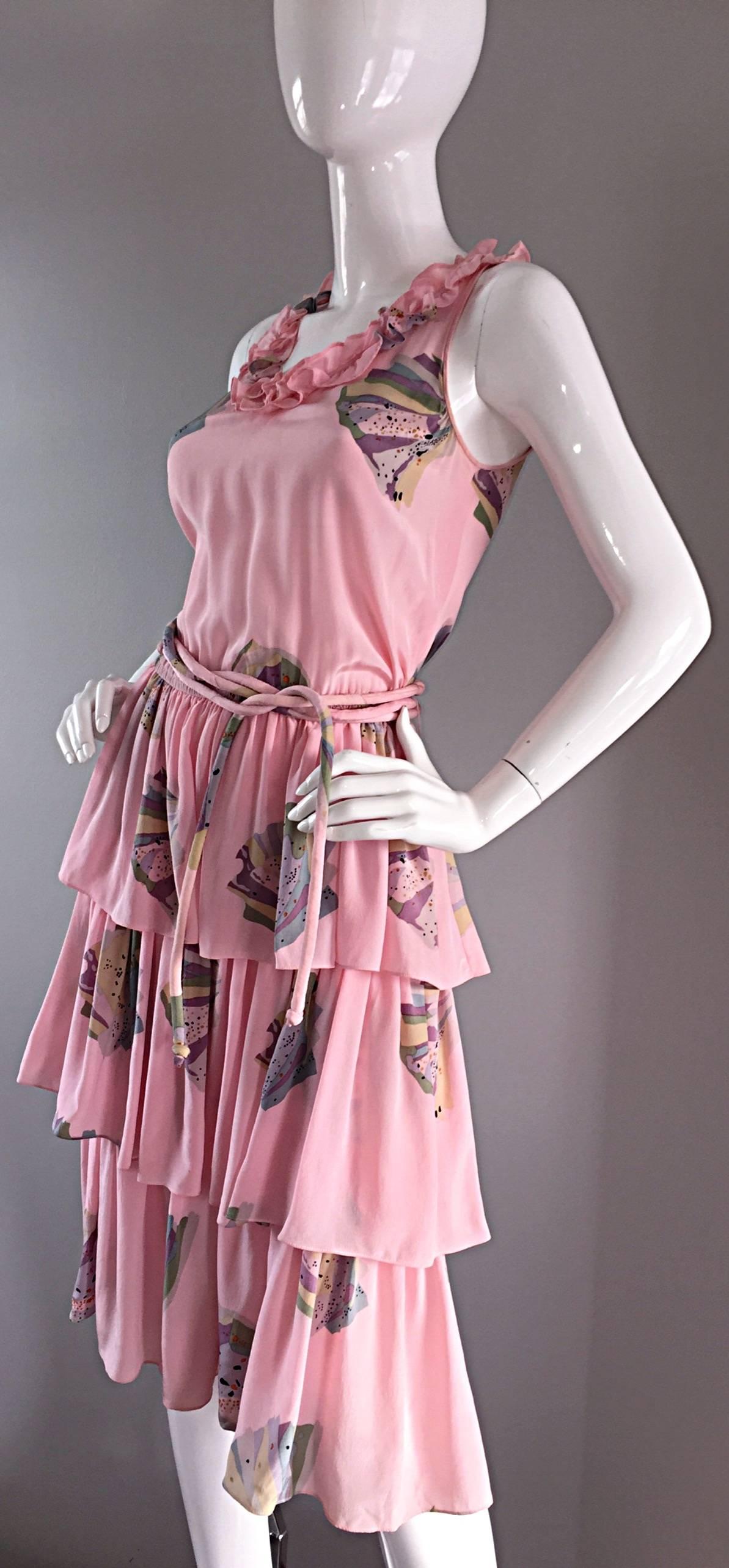 Beautiful vintage Mary McFadden flapper style dress! Light pink silk, with fan prints throughout. Three tiered layers on the skirt, with a ruffled neck. Long corded belt can be wrapped around the waist a few times, or left in a long bow. Looks