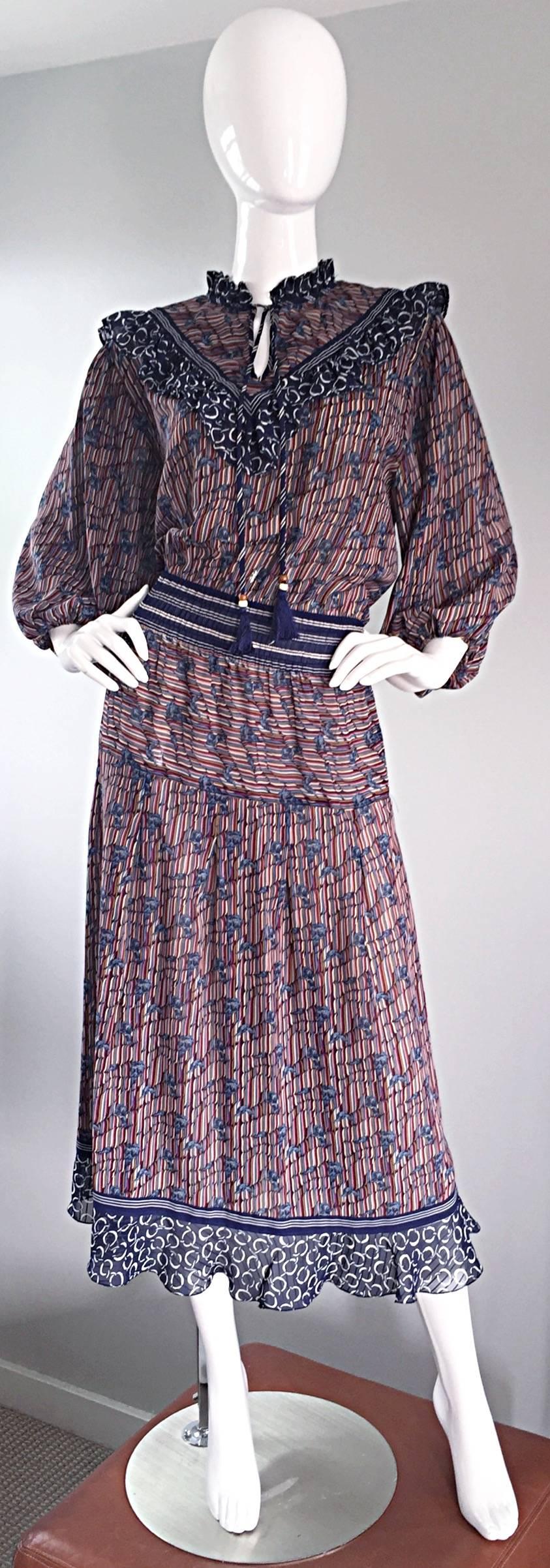 Awesome vintage Diane Freis ( Fres ) boho dress! Features horsebit and leaves printed throughout. Ruffle detail at neck, with attached tassels at each side, edged with beads and fringe, which can be left open, or tied close for a more conservative,