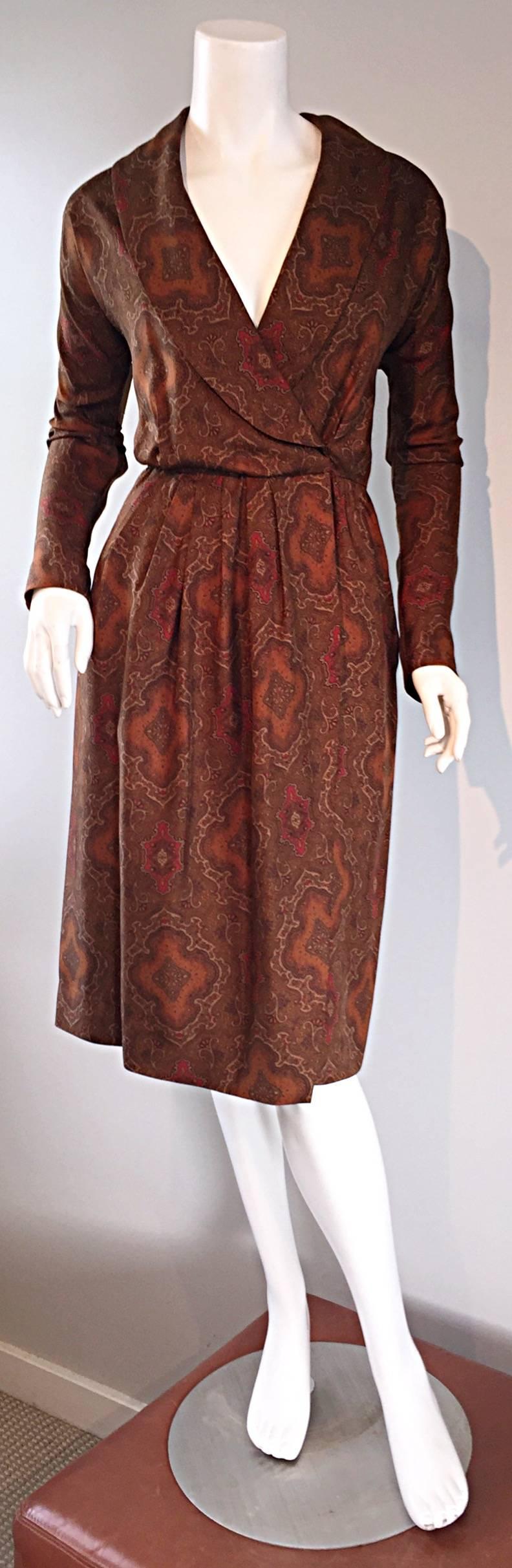 Striking vintage early 1990s CAROLYNE ROEHM wrap dress! Regal paisley print, on luxurious silk, in autumnal tones. Elegant shawl collar. Sleek long sleeves. Built in interior support at waist, to ensure everything stays put (and dress stays closed).