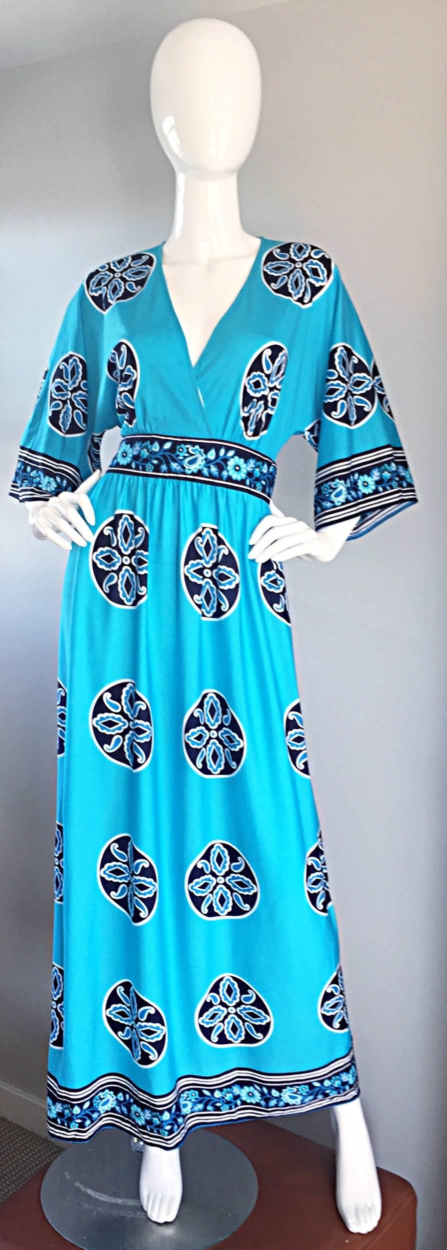 Incredible vintage 1970s jersey maxi dress! Vibrant aqua blue color, with mosaic print throughout, and flower trim at waist, sleeve cuffs, and hem. Perfect bell-shaped sleeves. Looks amazing on, and can easily transition from day to night. Great