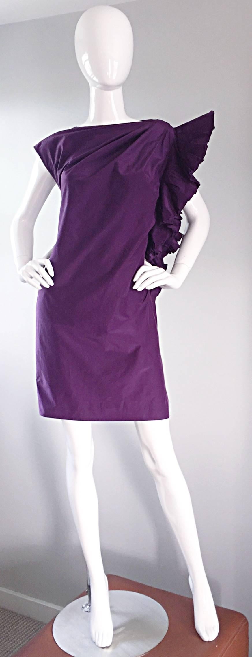 
Beautiful vintage Gianfranco Ferre purple eggplant silk dress! Features origami detail at one shoulder, which can be worn a number of ways. Amazing rich color, and fantastic attention to detail, which in turn, flatters many shapes and sizes. The
