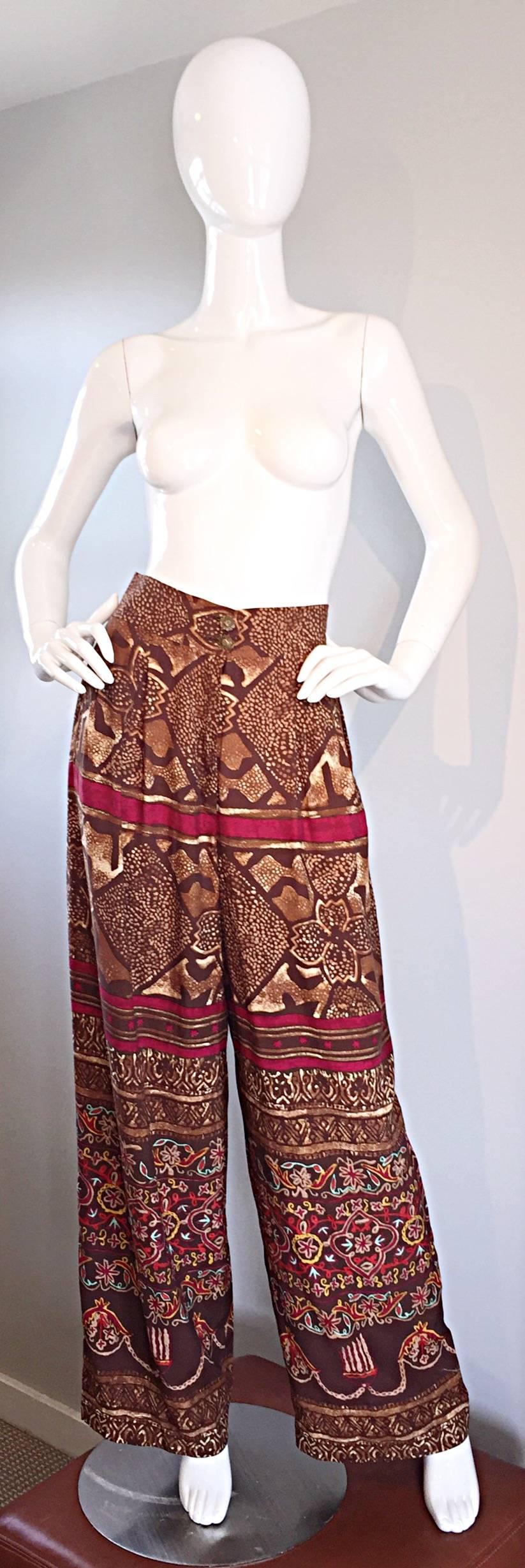 Incredible vintage CHRISTIAN LACROIX trousers! Flattering high waist, with zipper at fly, and two brass floral buttons at waist. Ethnic, tribal print, with a touch of animal! Fitted, with a wide leg. Extremely rare, and super impressive on! Pairs