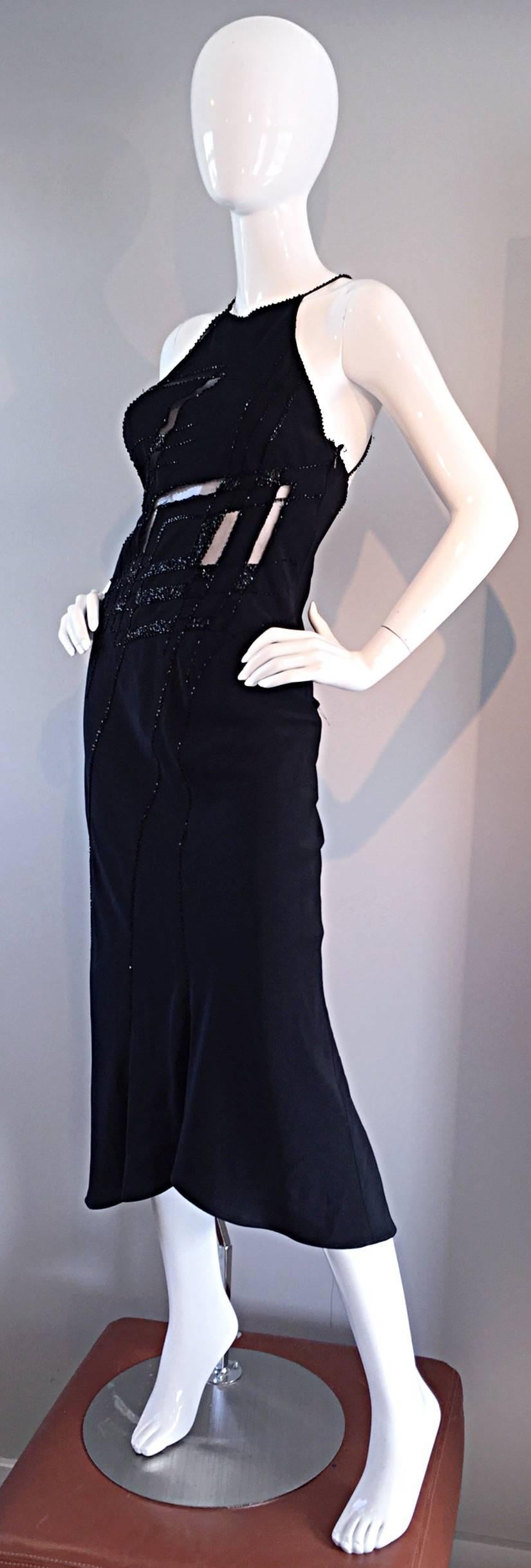 Gorgeous vintage LILLIE RUBIN black silk dress!!! Heavy attention to detail on this well made dress! Features cut-outs on the front, which are lined with black mesh. There is also one in the back. Fully beaded straps, that criss-cross in the back