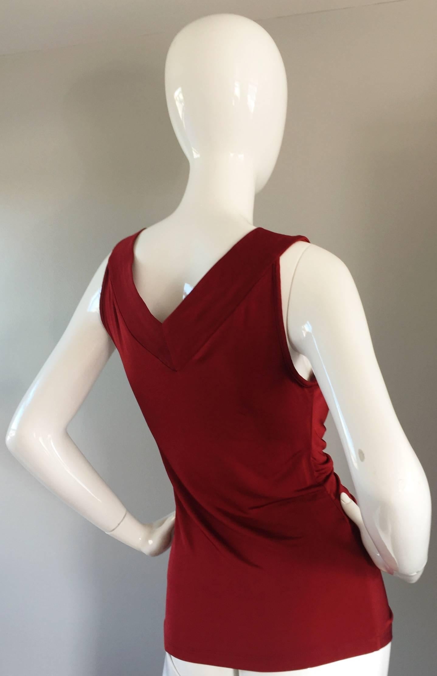 Beautiful JOHN GALLIANO crimson red silk jersey blouse! Features extremely flattering (and slimming) ruching down the bodice, which make for a 'Grecian' feel. Looks amazing on the body! Also, looks good belted. Perfect from day to night. Great with