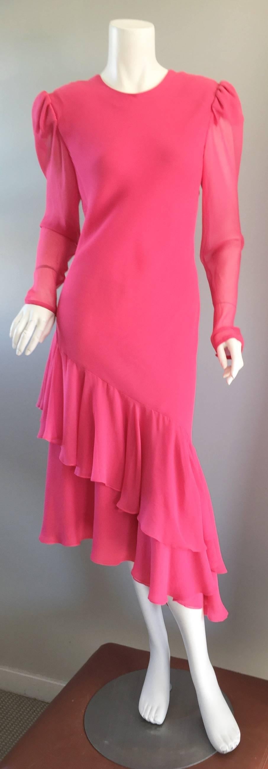 Beautiful vintage CAROLINA HERRERA pink silk chiffon dress! Layers and layers of couture quality silk chiffon! Wonderfully tailored, with slim long sleeves, an asymmetrical ruffled hem line, and a tie at the back. Prettiest pink color! Great alone,