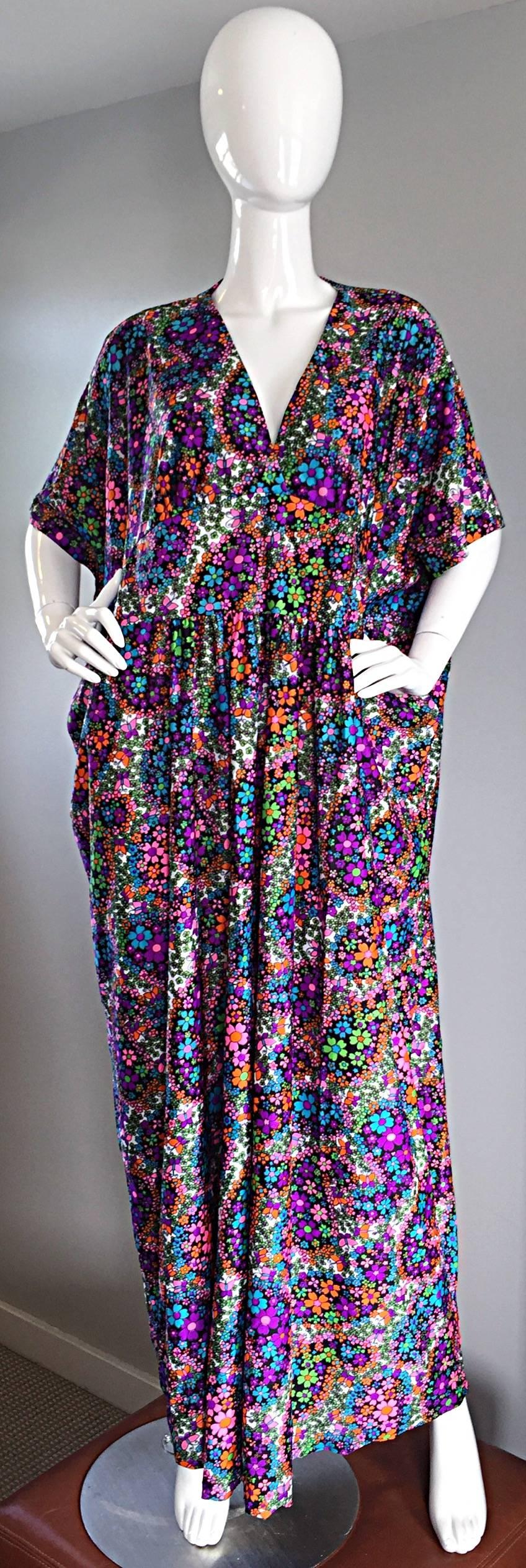 Incredible vintage 70s caftan / kaftan! Pretty much every color of the rainbow are included in this beauty, which feature flowers and butterflies throughout. Perfect by itself, or great as a swimsuit cover-up. A definite MUST! In great condition.