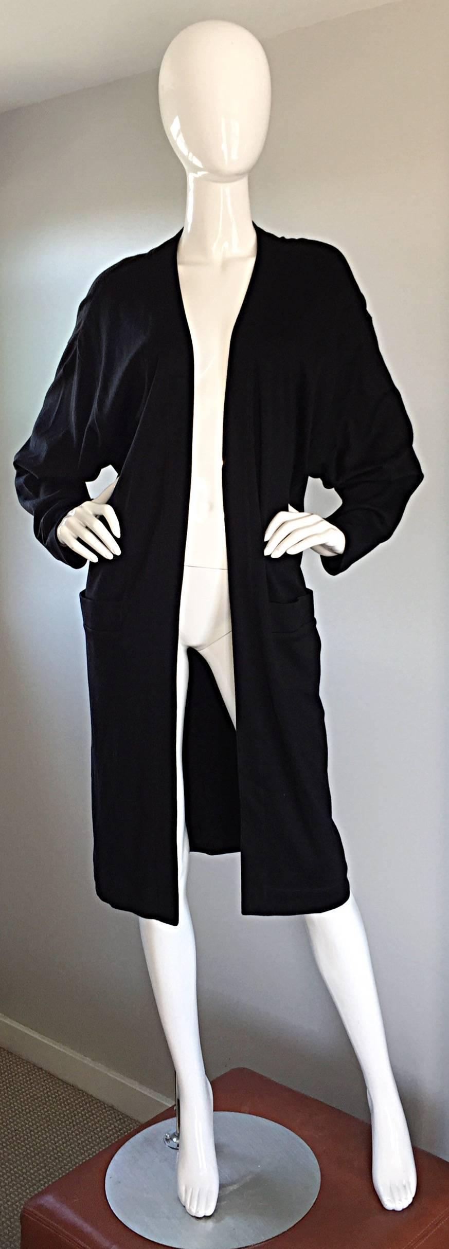 Chic, and timeless vintage DONNA KARAN 'Black Label' open front long cardigan. Jet black color, on soft, thick (but, not too thick) cotton. Dolman sleeves, and POCKETS at both sides of the waist! Such a flattering fit, that is perfect for any