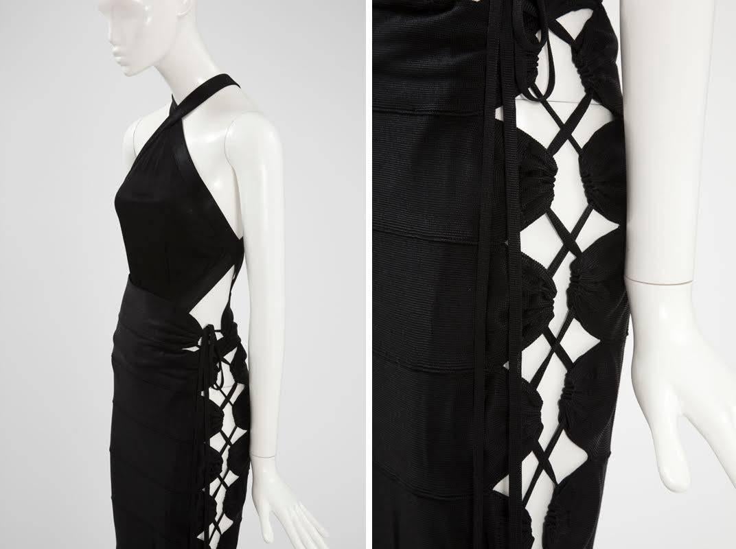 Consisting of a bodysuit and a cut-out long skirt, this exceptional and iconic Alaïa design featuring adjustable bandage is nowadays displayed in museums and/or targeted exhibitions like the last Alaïa retrospective at the Galliera museum in Paris