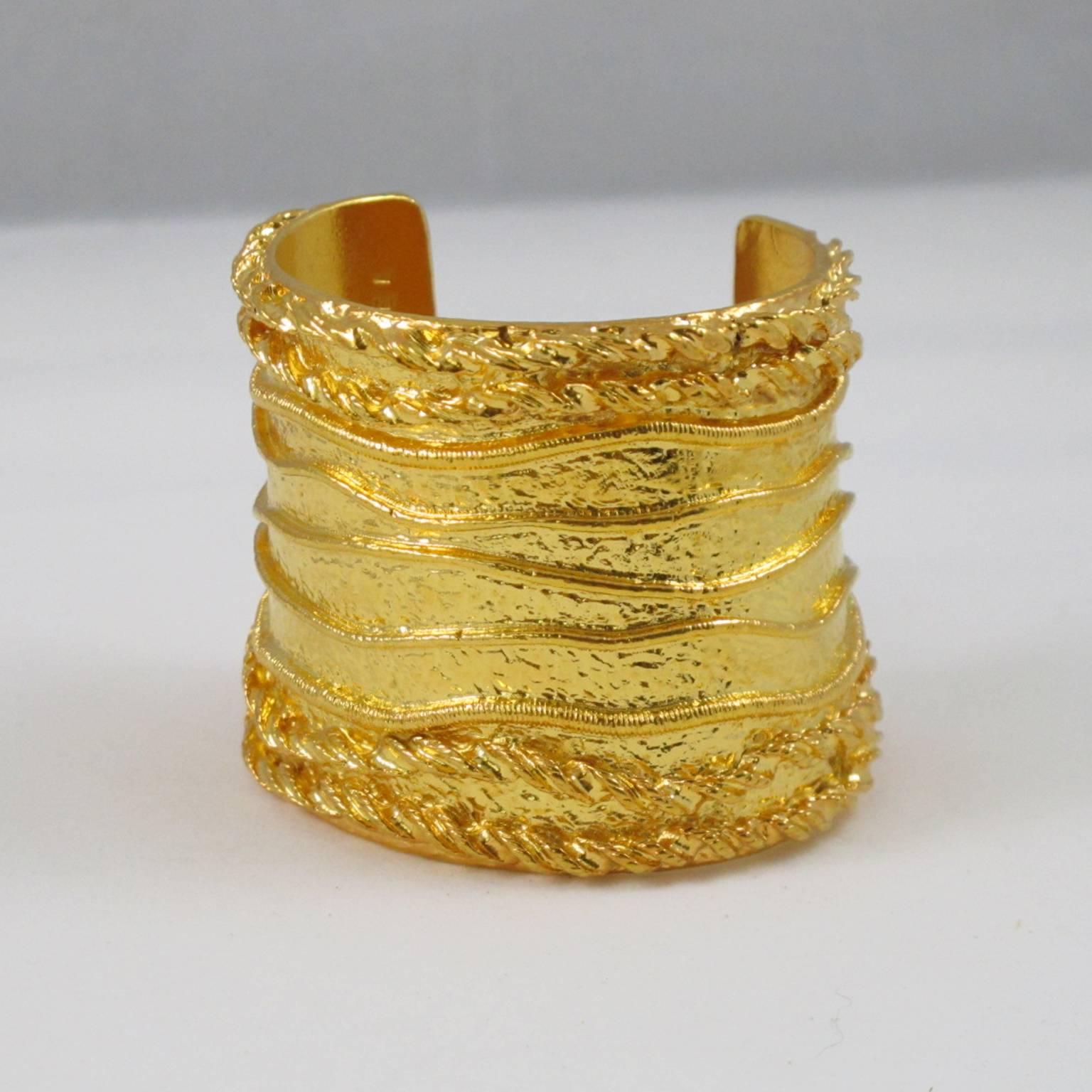 SONIA RYKIEL Paris signed Cuff Bracelet. Massive baroque slave shape with gilt metal all textured and carved. Signed by famous French Jewel and Fashion Designer Sonia Rykiel: "Inscription Rykiel" engraved inside. (The label