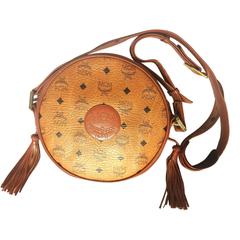 Vintage MCM rare brown monogram round shoulder bag with brown leather trimmings.