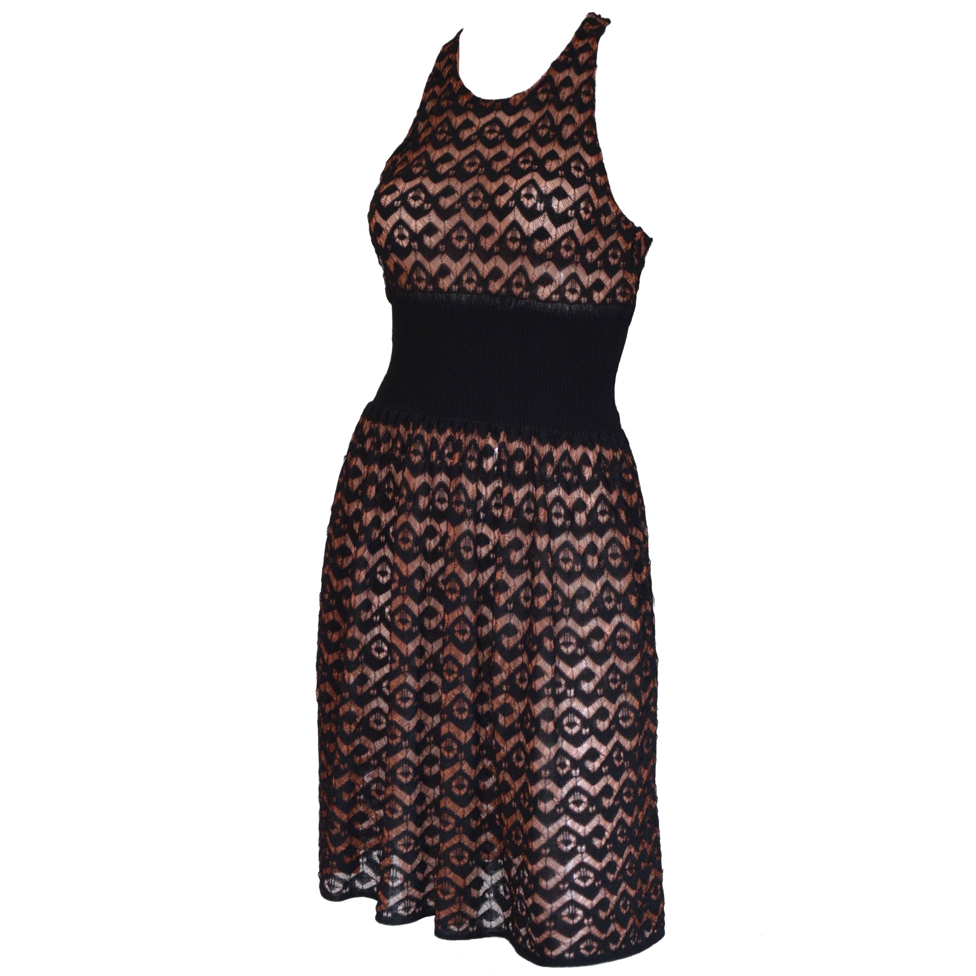 Azzedine Alaia black lace dress with built in beige-pink slip dress and shaped underlined waist. Sophisticated back detail. Circa 2015.
Fr size : 40 
Fits a Small - Medium