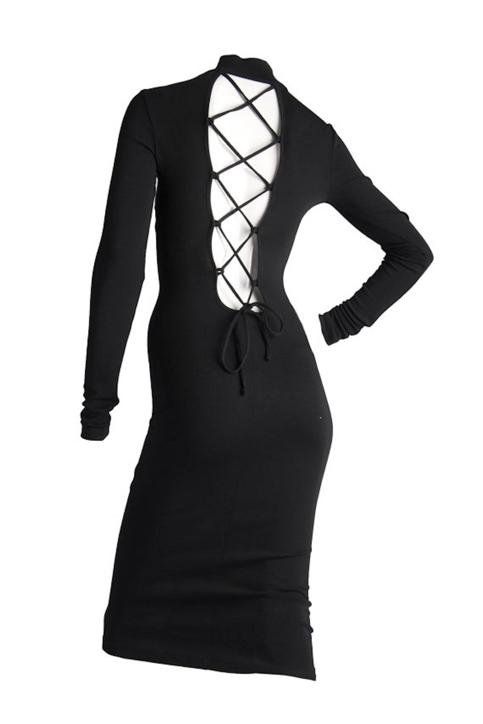 Dolce & Gabbana black stretch open back tie detail dress, also has zip on shoulder. Long sleeve sand midi length. From the late 1990s

Size 40 on the label. UK 8/10. 16 inches across bust and 44 inches length.