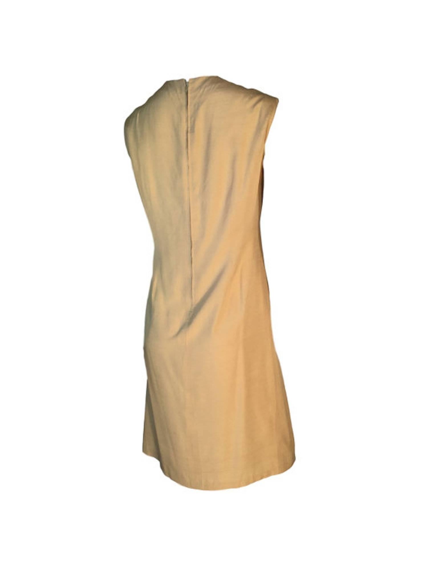 Pierre Cardin cream silk dress, 1960s shift dress with metal back zip entry, has panel detail at the front.

Size UK 14 measures 20 inches across bust, 16.5 inches across waist and 42 inches length. 