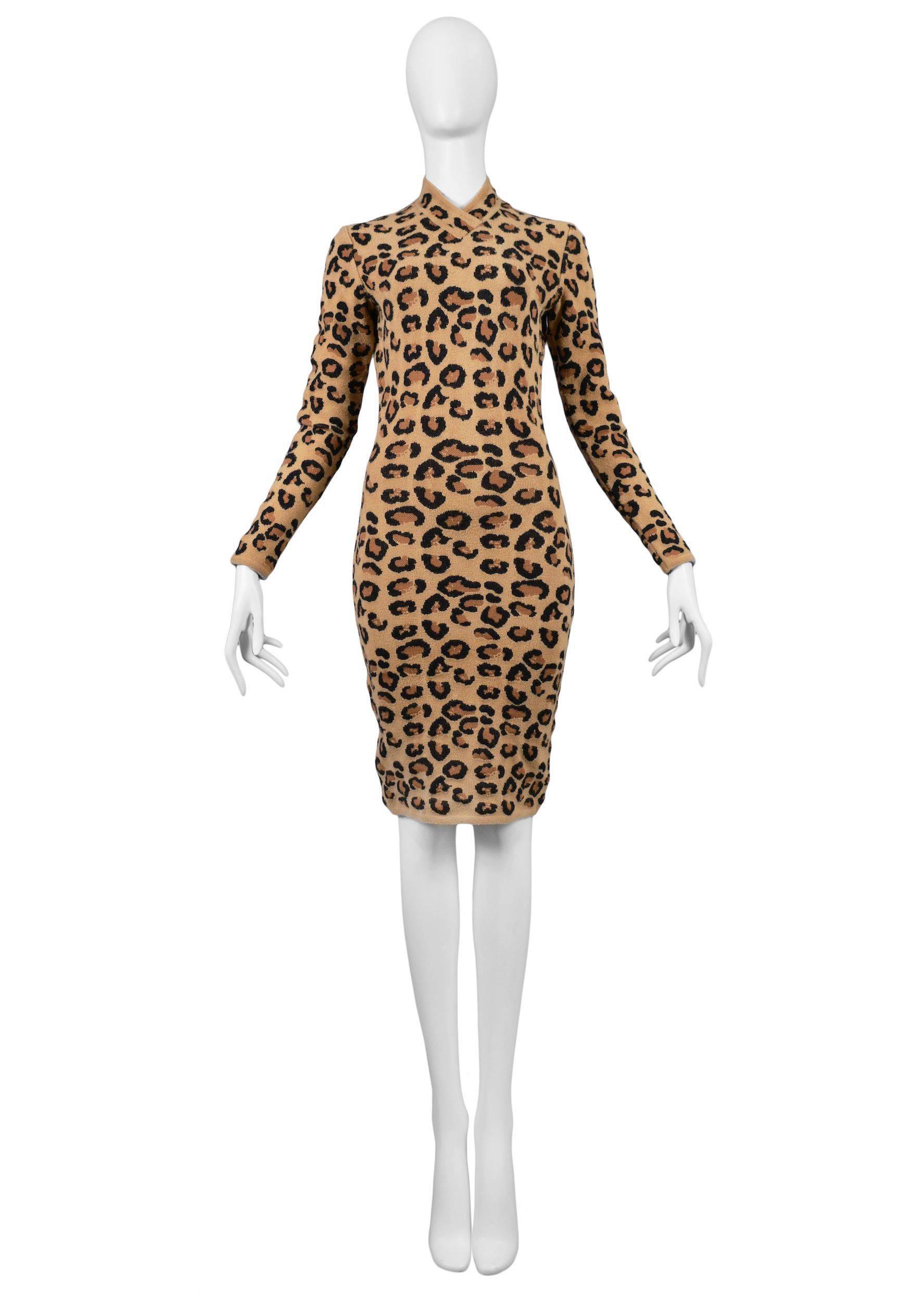 Vintage Azzedine Alaia leopard wool knit bodycon dress featuring a v-neckline and long sleeves with a back zipper closure. Featured in numerous editorials, on the runway, and included in many museum collections. A must have for Alaia collectors.