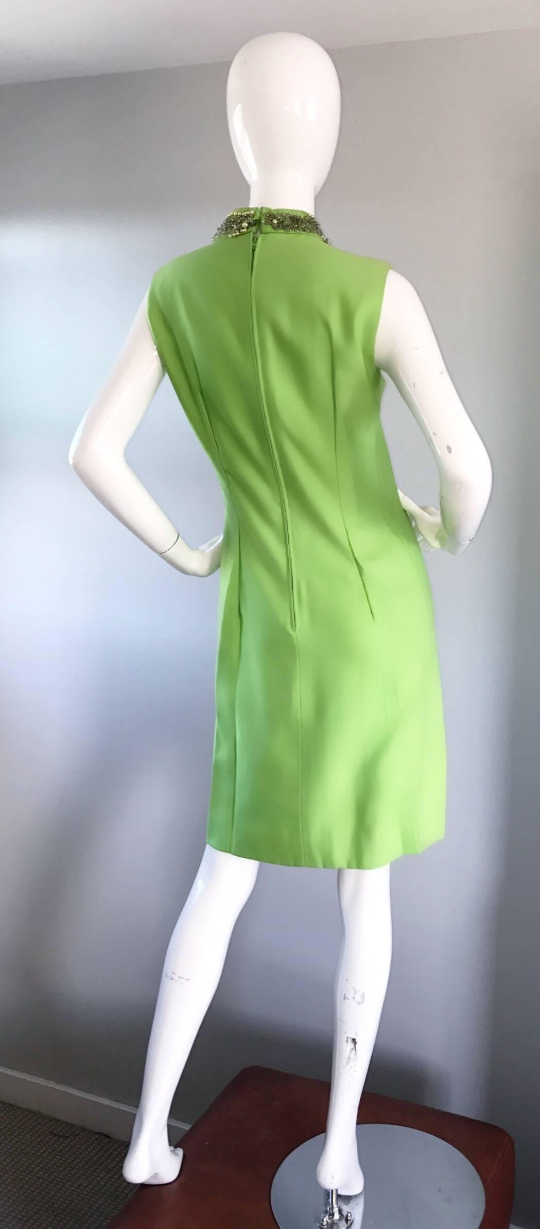 Chic vintage 1960s lime green shift dress! Flattering shilouette, with amazing details! Features hand-sewn iridescent sequins and beads at bust, with pearls lining the collar. Jackie O style that exudes class and fashion! Designer labels are