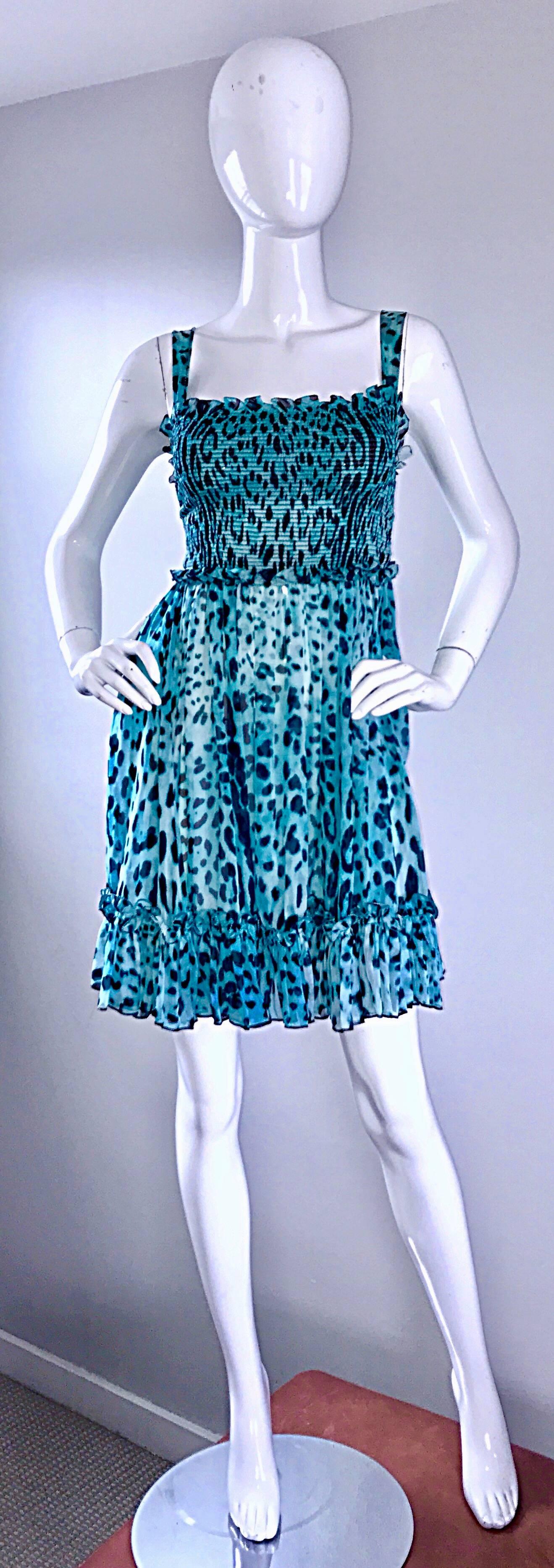 Brand new GIAMBATTISTA VALLI vibrant blue silk chiffon Babydoll dress! Features an allover blue and black cheetah print. Ruffle details at hem, bust, and waist. Stretch to fit bodice is very flattering. Flirty full skirt. Softest silk chiffon feels